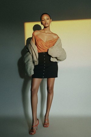 Black Ribbed Knit Mini Skirt with Snap Buttons