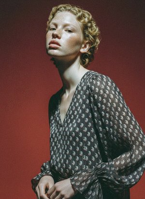 Elegant Sheer Patterned Blouse with Ruffled Sleeves