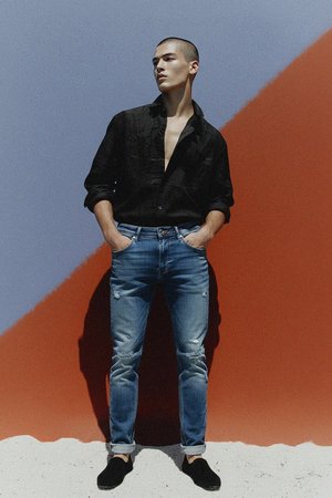 Distressed Blue Denim Jeans